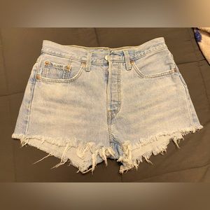 Levi’s 501 cut-offs. Size 27. Red tag.